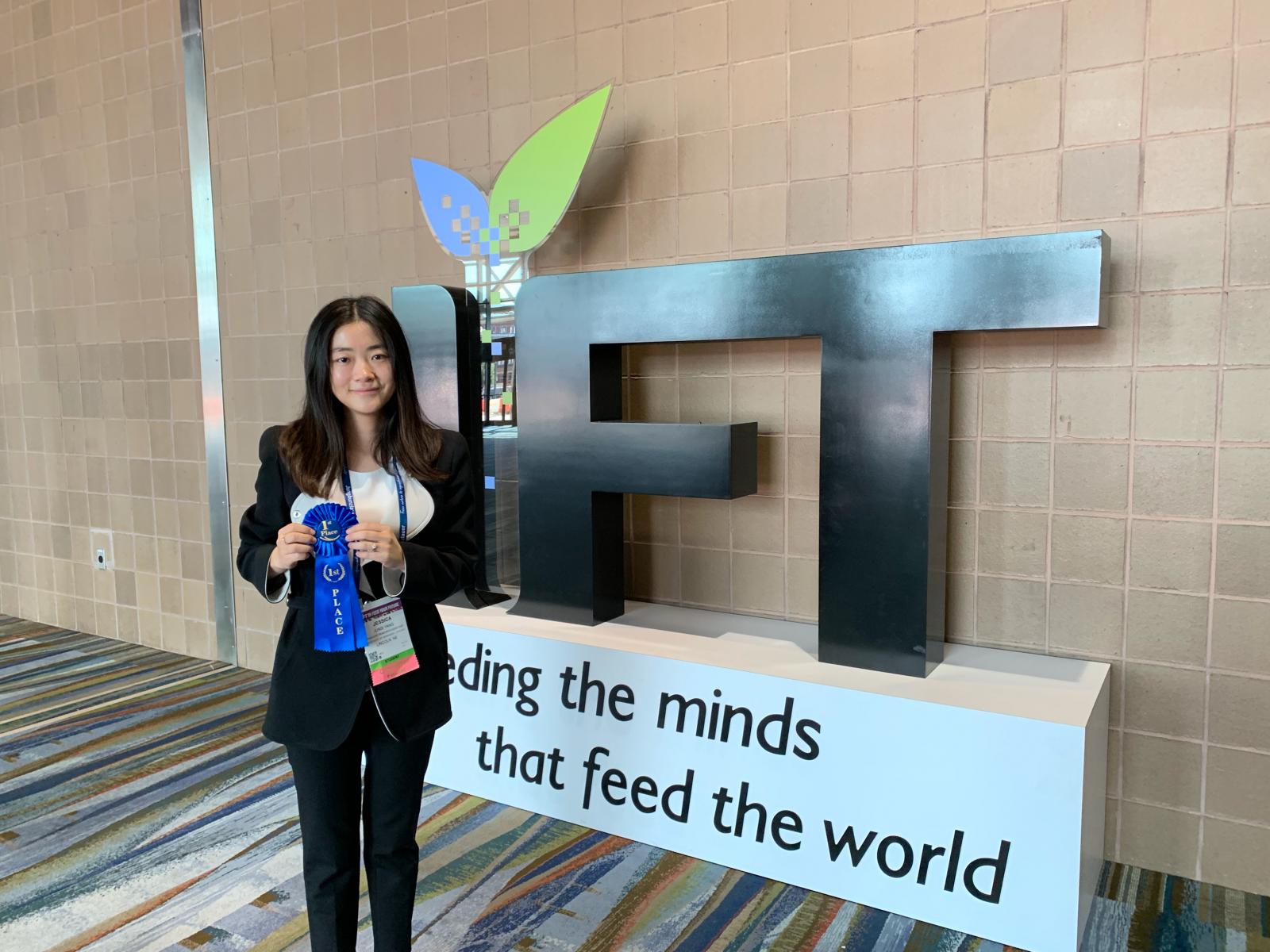 Jessica holding her first place ribbon at IFT19 Annual Meeting & Food Expo in New Orleans, LA