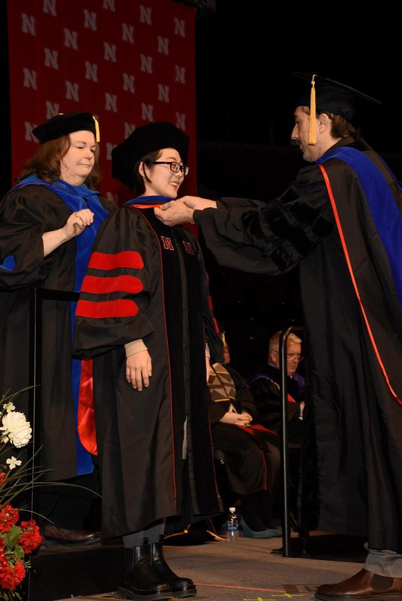 Lingyi while receiving her doctoral hood from Dr.Ciftci  