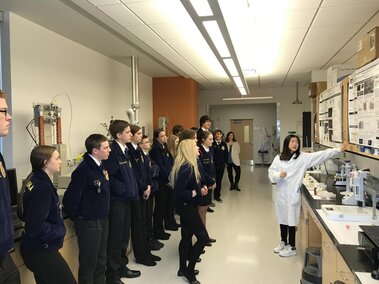 Jessica explaining her research to high school FFA students