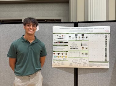 Jaden presenting his poster at UNL Student Research Days.