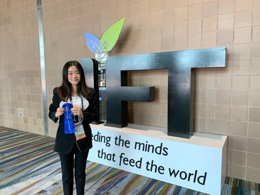 Jessica holding her first place ribbon at IFT19 Annual Meeting & Food Expo in New Orleans, LA