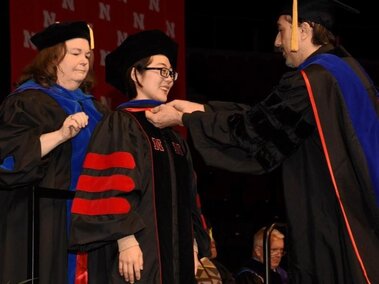 Lingyi while receiving her doctoral hood from Dr.Ciftci.