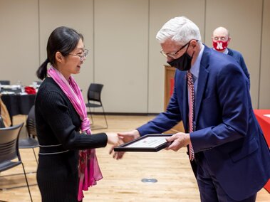 Lingyi receiving her 2021 Skala Fellowship certificate from Dr. Archie Clutter, Dean of UNL's Agricultural Research Division